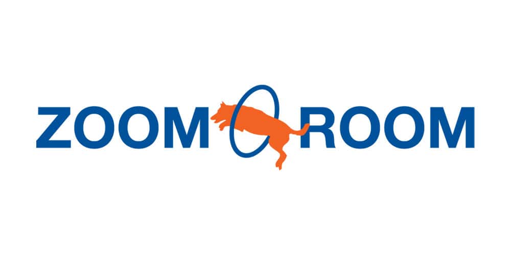 Logo featuring the words "Zoom Room" in blue, with an orange dog jumping through an "O".