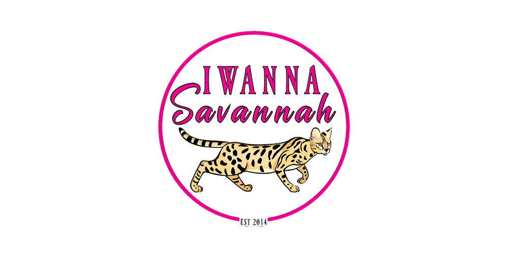 A circular logo with the text "IWANNA Savannah" above an illustrated spotted cat, outlined in pink, with "EST 2014" at the bottom.